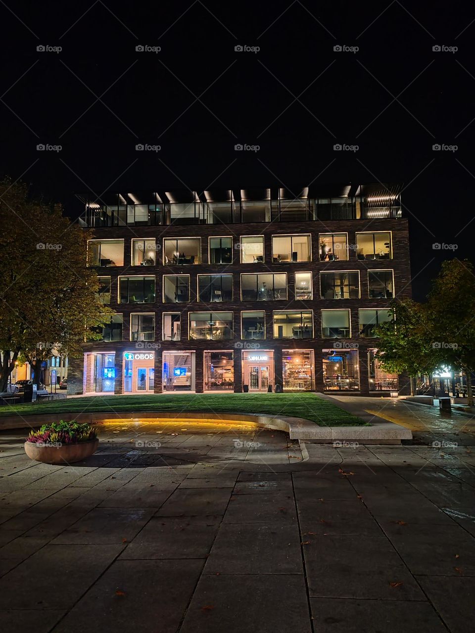 The image is taken from a low angle, providing a wide view of the building and its surroundings.