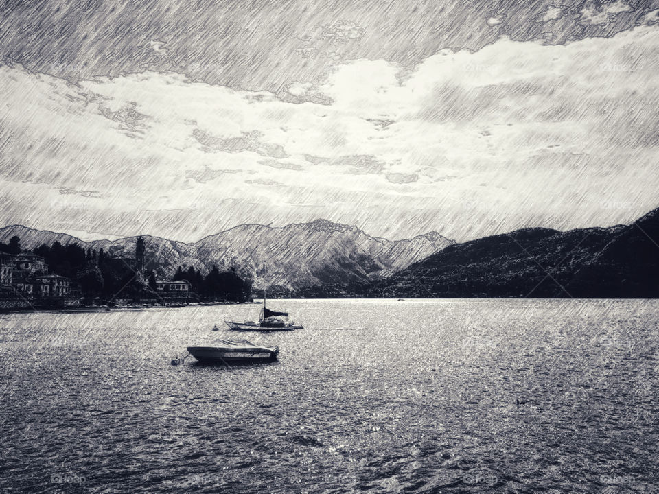 Pencil drawing sketch mountain, sky and sea view with and boats in Menaggio, Lake Como, Italy.