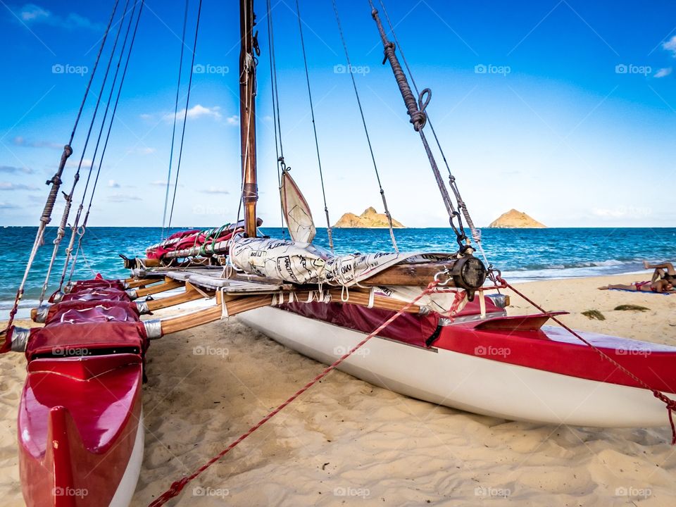 Hawaiian outrigger sailing canoe on Lanikai beach, Hawaii.  