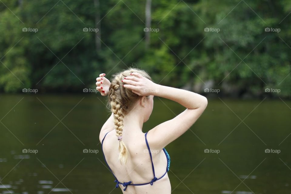 A girl on a green river