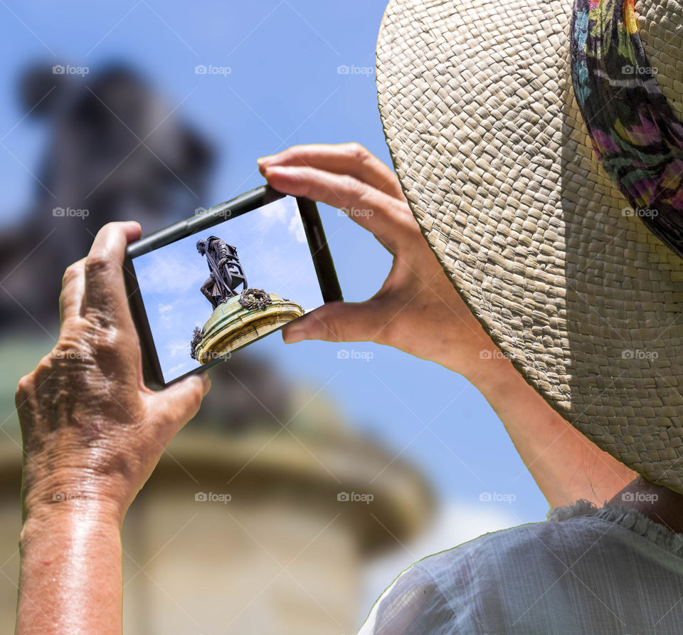 Phone. Camera phone Tourist taking a picture with a smartphone cell phone mobile phone camera 