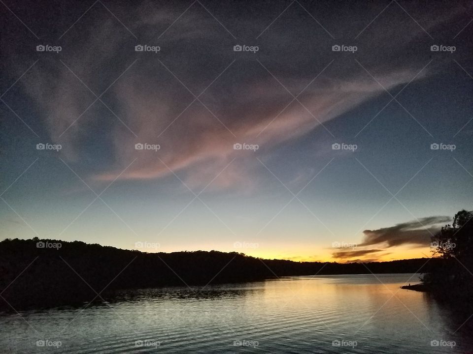 clouds, lake and waves during sunset