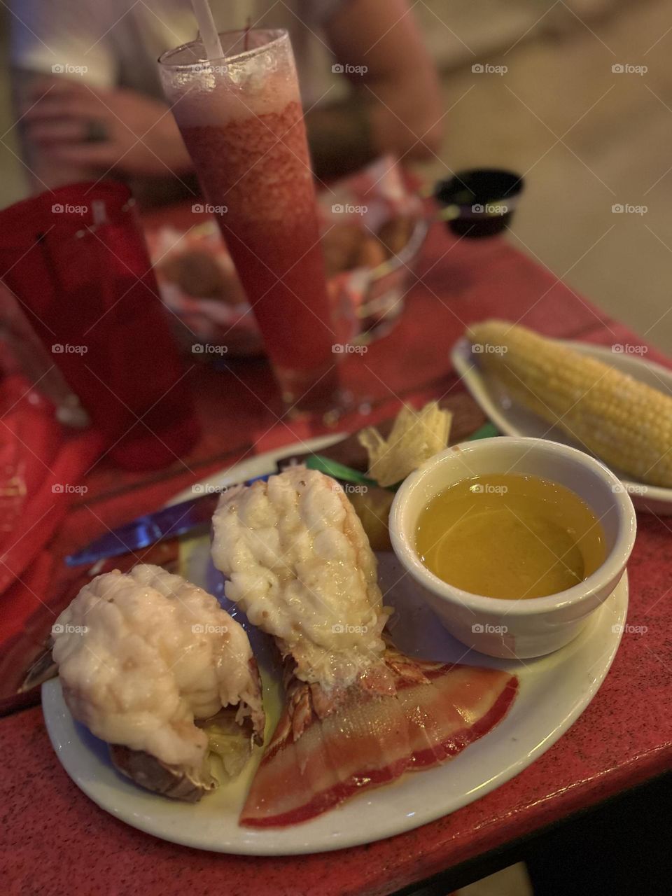 Dining in the sand. Friends, drinks, lobster and the beach 