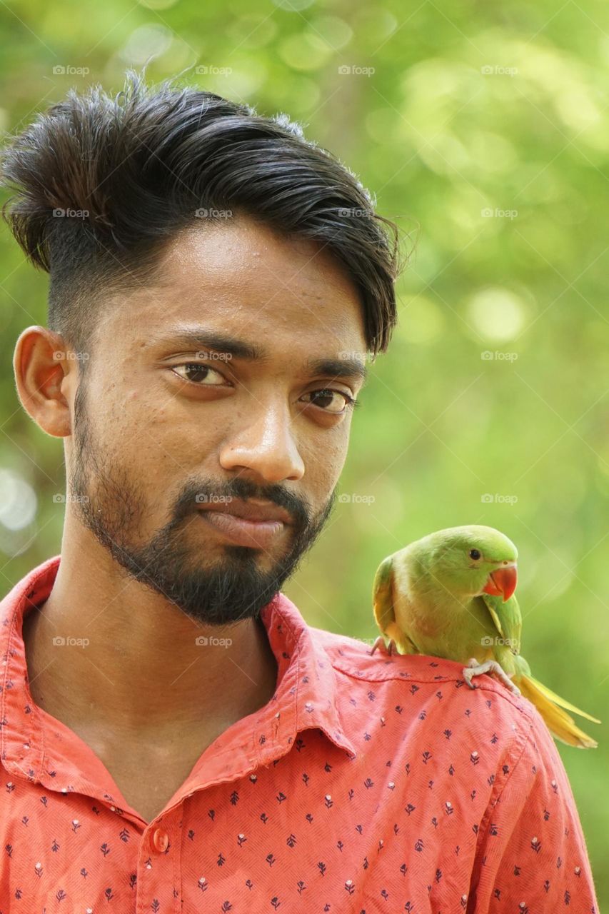 Beautiful bird Parrot and human friend ship