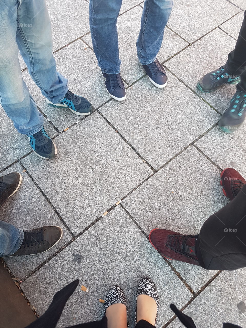 People's shoes gathering together