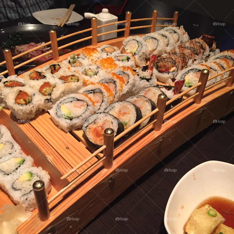 Sushi bridge. Sushi bridge with maki rolls
