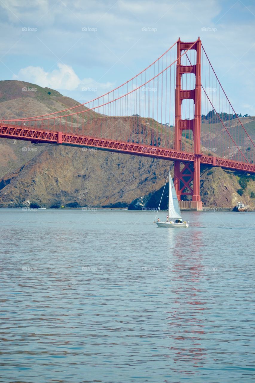 View of Golden Gate bridge and sail boat