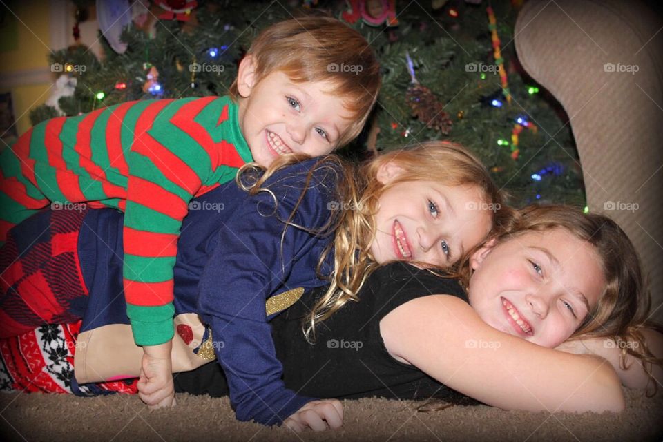 Happy brother and sisters playing