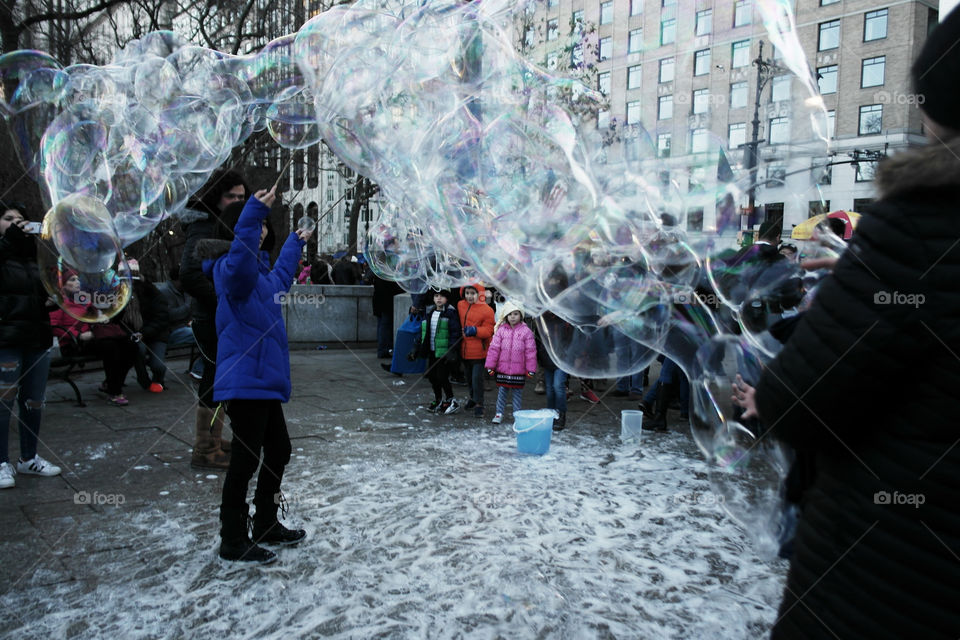 Playing with soap bubbles in Central Park NY