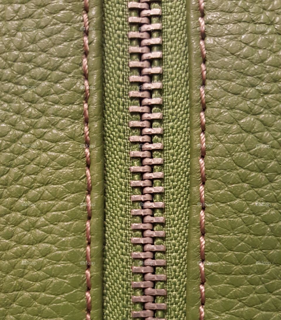 Zipper on green purse