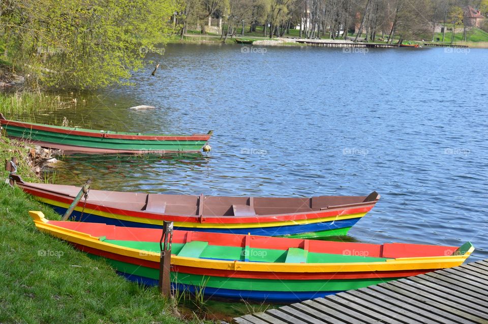 colorful boats by lakeshore