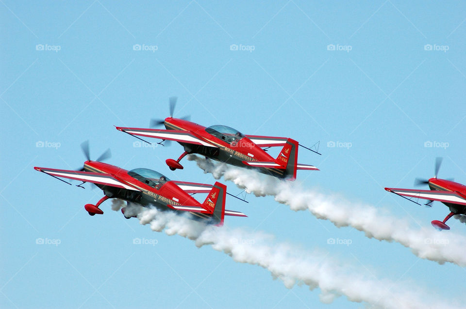 sky red plane smoke by marcografo