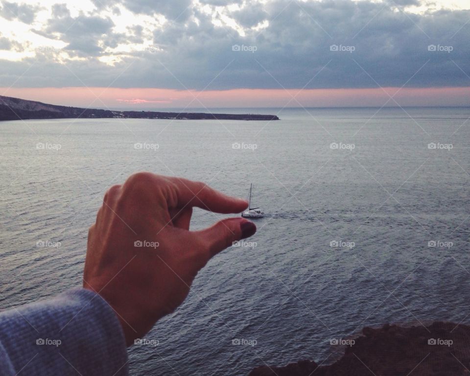 Hand catching a ferry in the sea 