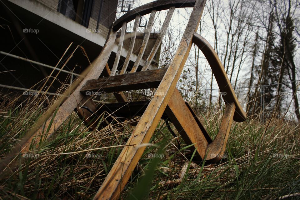 chair in grass, lost place