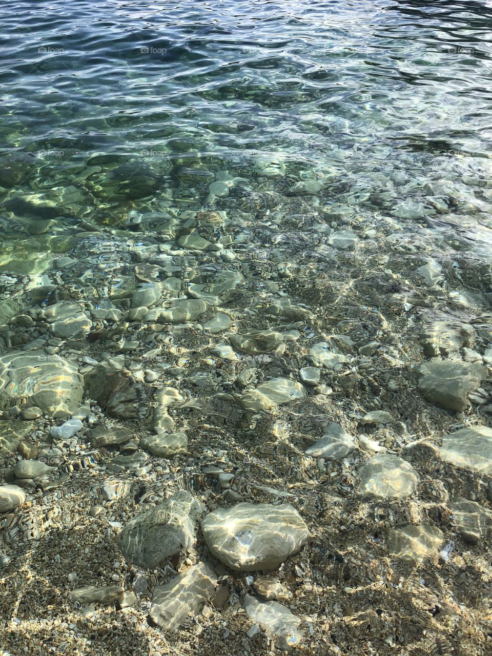 Crystal clear water, so translucent you can practically see your face in it! 