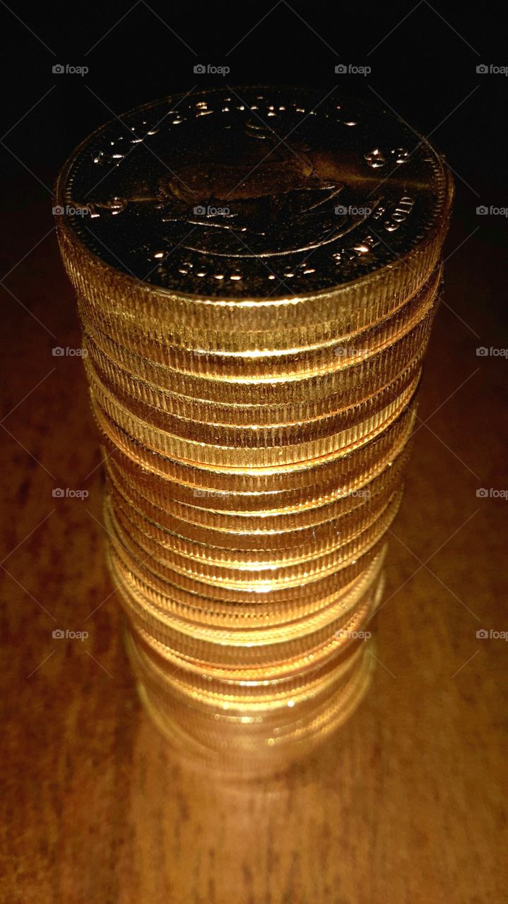 stack of krugerrands. stack of gold coins