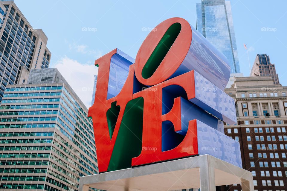 Close up of a LOVE statue from a lower POV