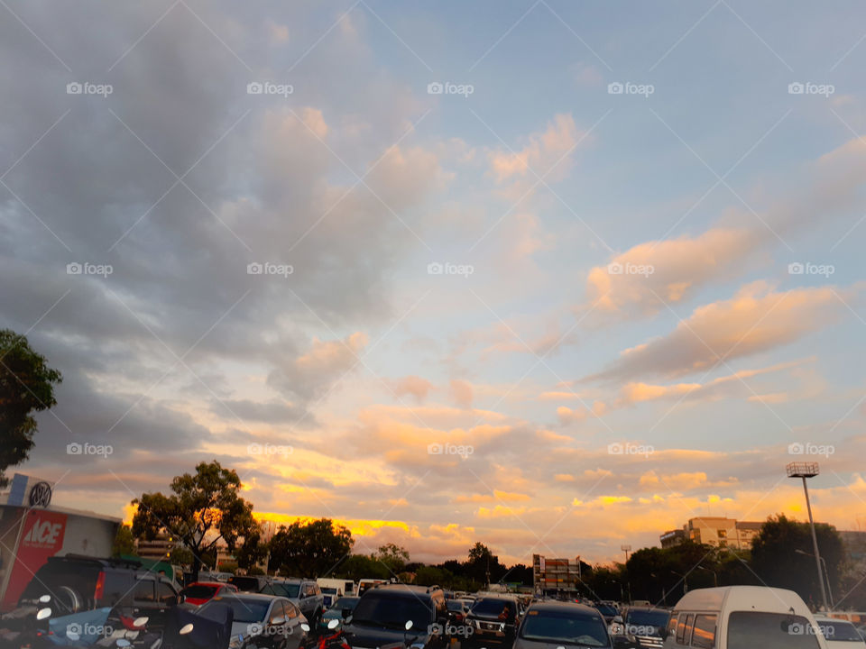 Heavy trafffc with beautiful clouds