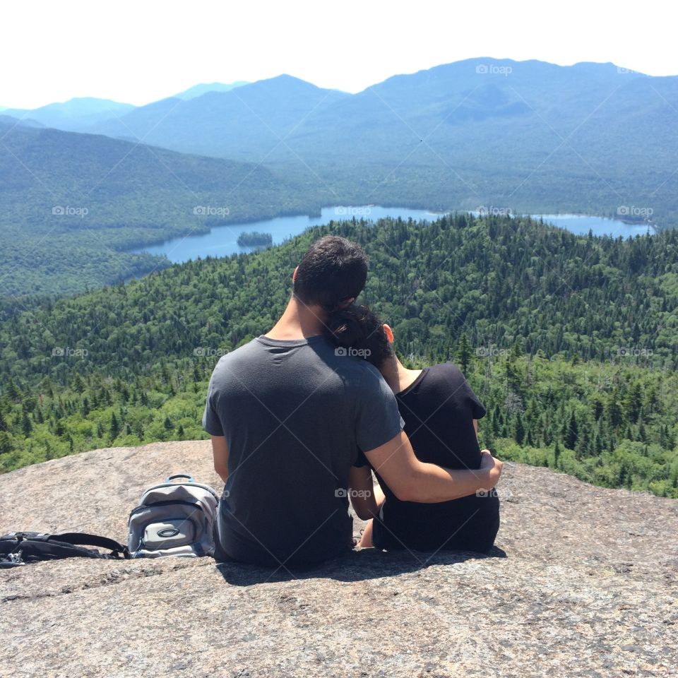Couples young love upon Ampersand Mountain upstate New York 