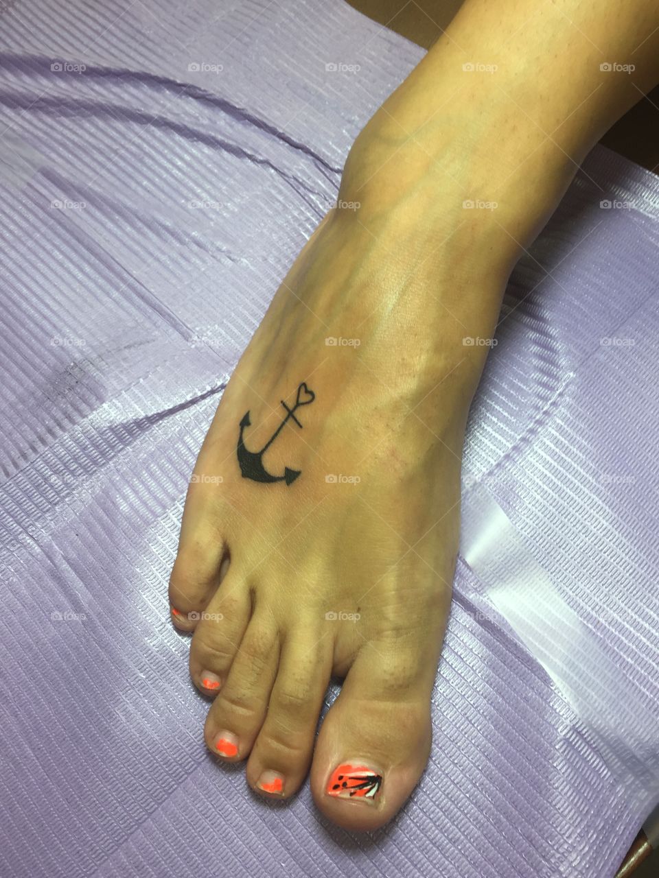 Anchor foot tattoo. 
