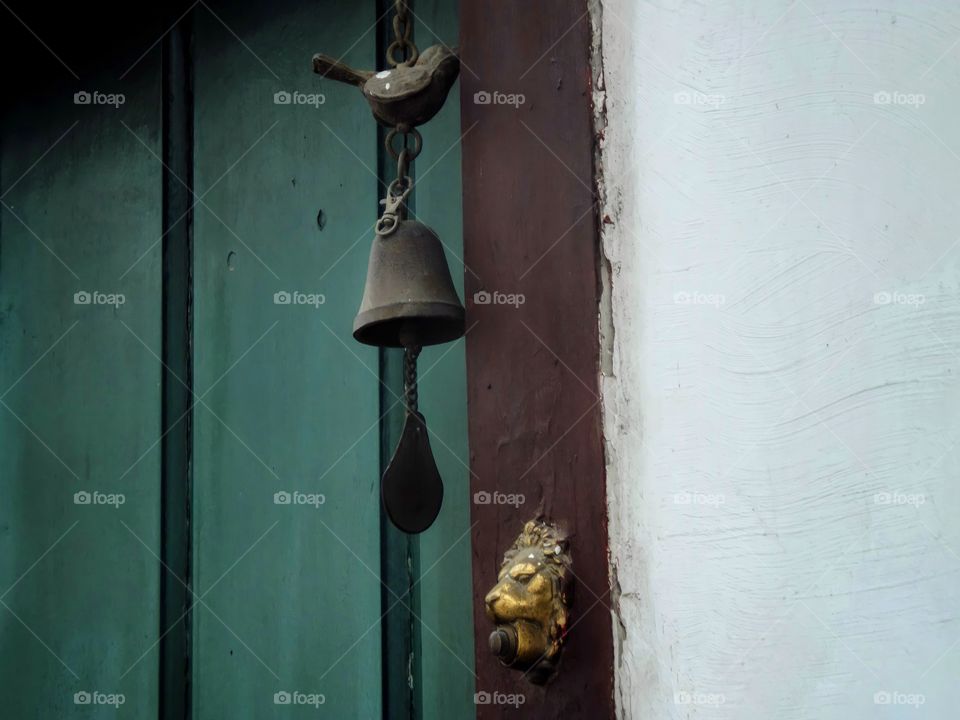 bell on the green door