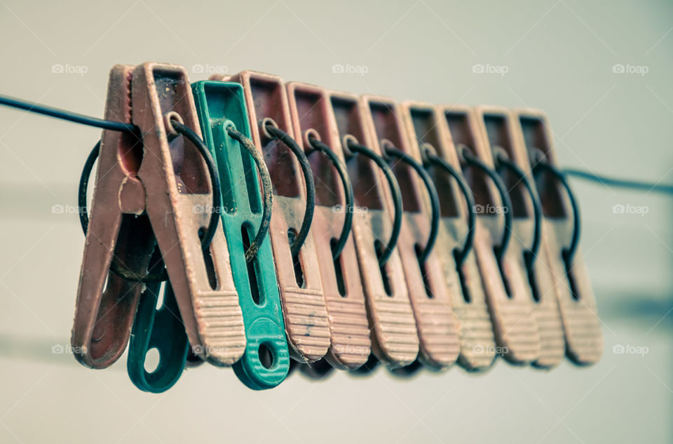 Hanging clips with one odd color.