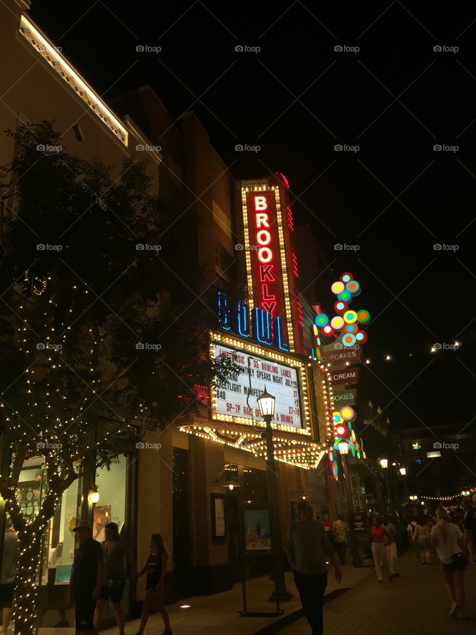 A classic old fashioned American cinema, with all the dazzling lights you can imagine. Bright colours catch your eyes, standing out on the jet-Black night sky. Trees twisted with fairy lights match the stunning sign. 
