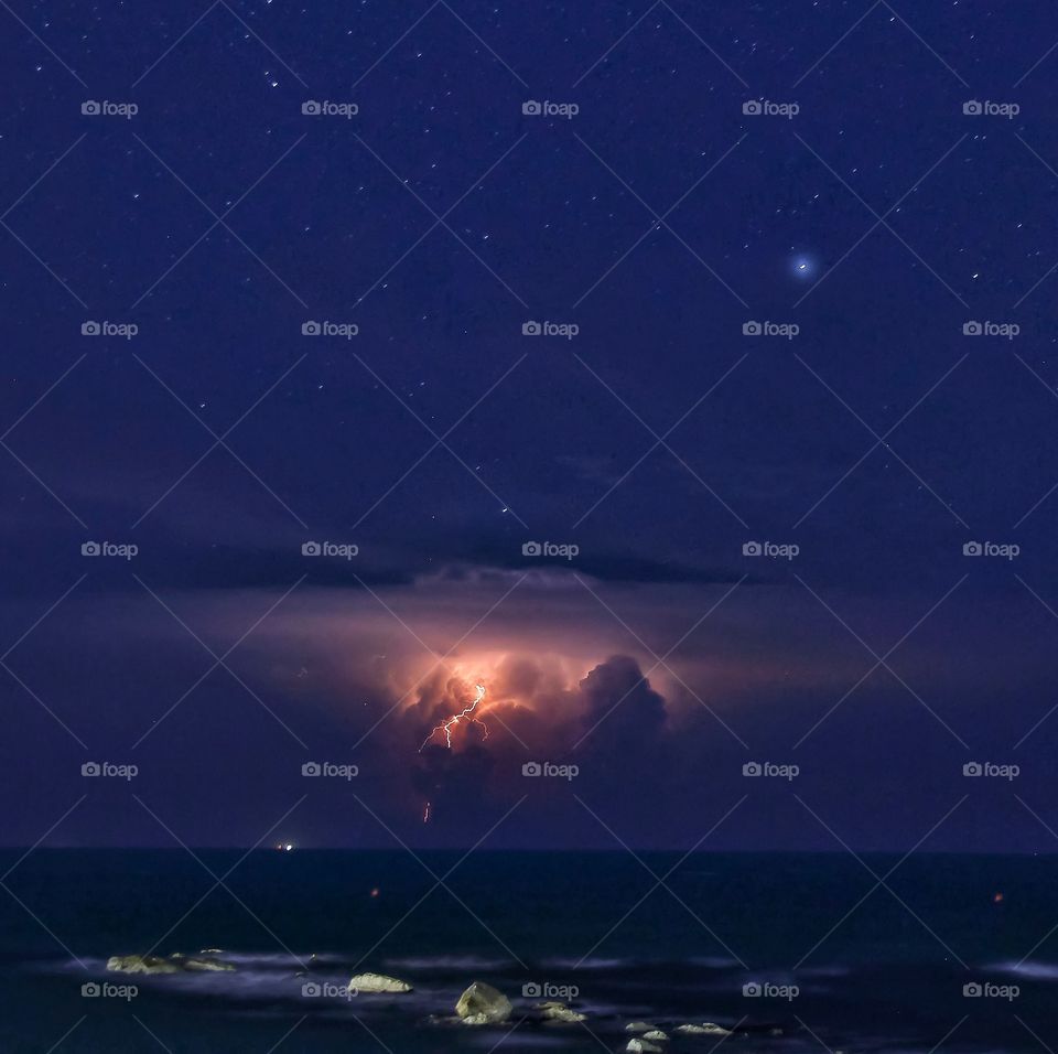 Night thunderstorm over the sea