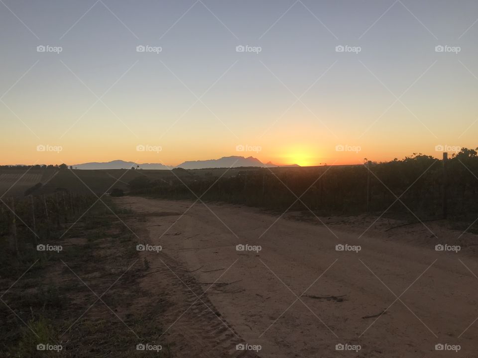 Sunrises, sunsets and the moon! Sleeping Giant with the sun setting behind it.