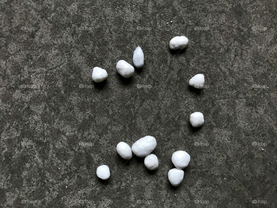 White small sweets in grey 