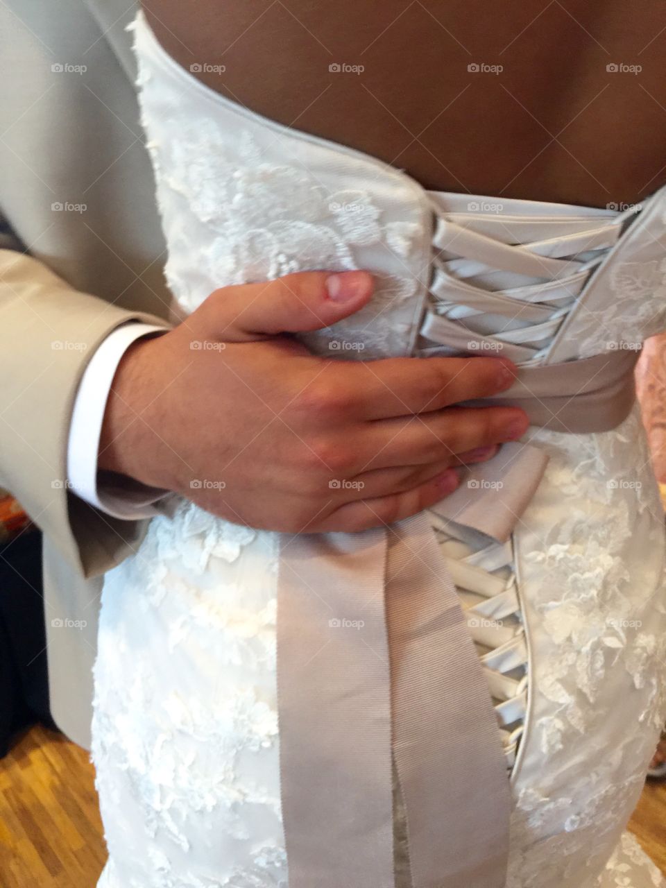 Wedding . Bride and groom dancing in a party, close-up, rear view