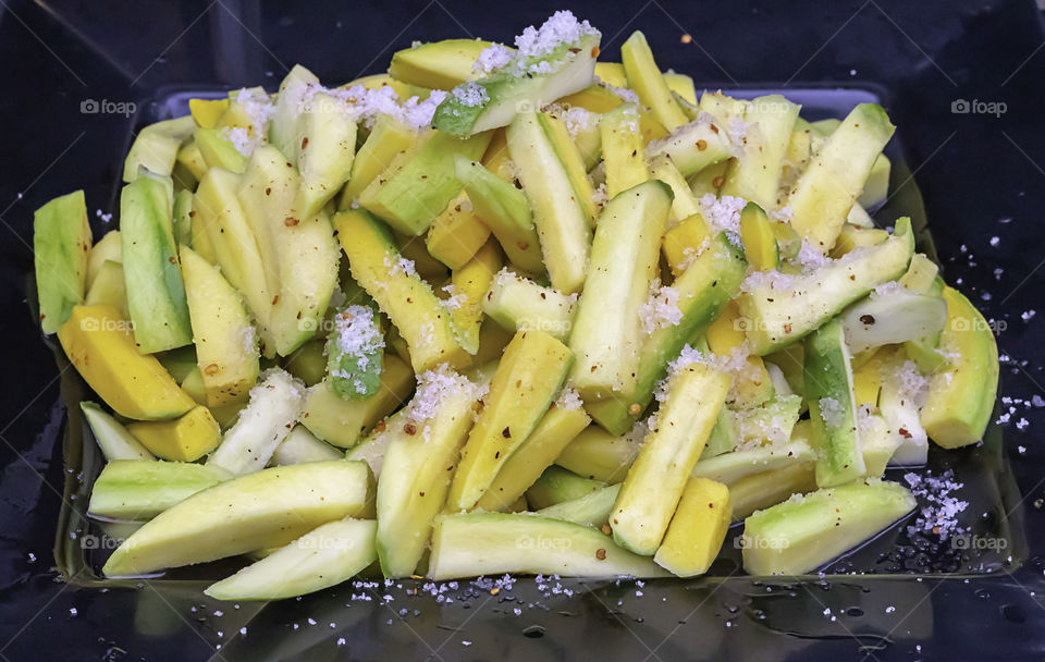 Mango cut into small pieces, sprinkle with salt, pepper and sugar.