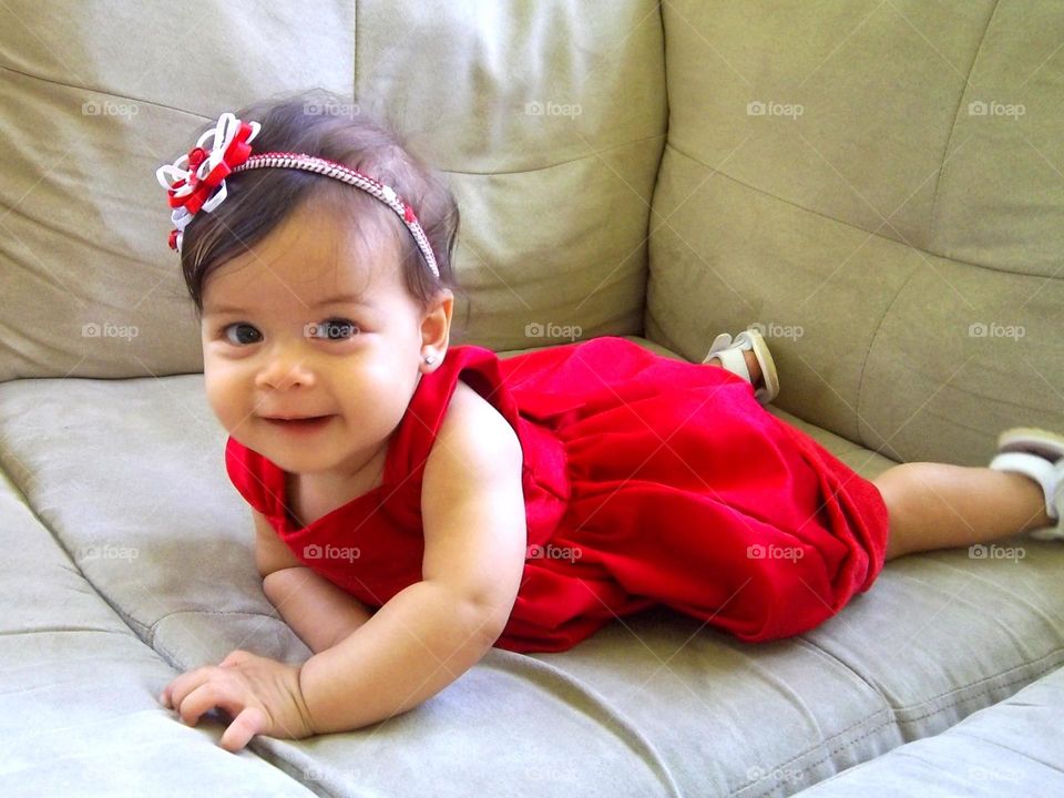 Cute baby girl wearing red dress