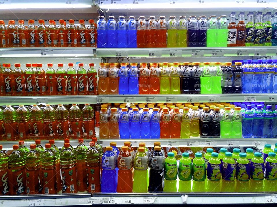 energy drinks and bottled juice sold in a grocery store