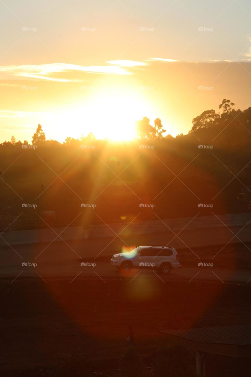 As cars drive by when the sun is setting, magic happens. 