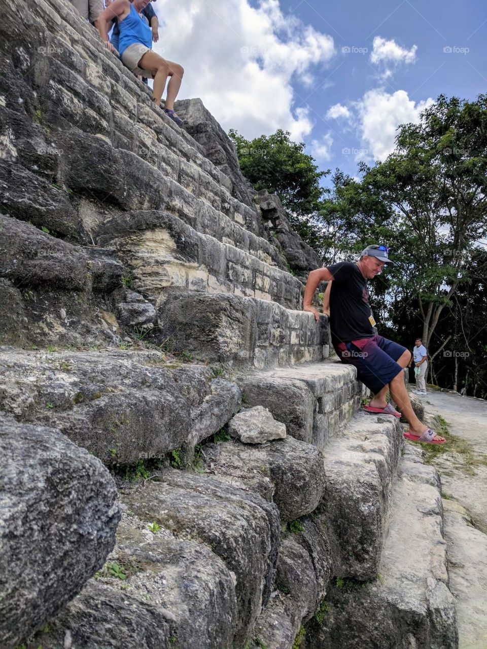 Climbing down carefully at High Temple Mayan ruins, Belize