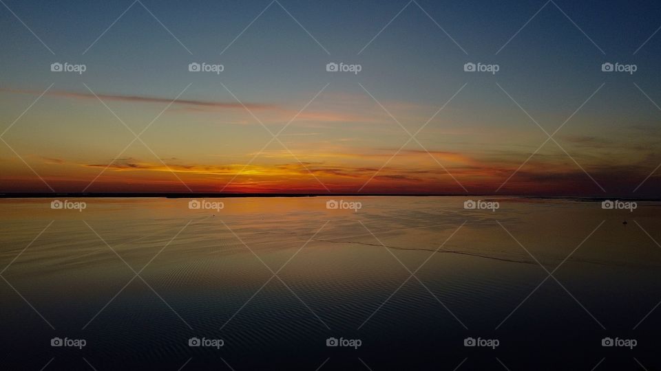beautiful birds eye sunset in Duck, NC taken by aerial pointe drone 