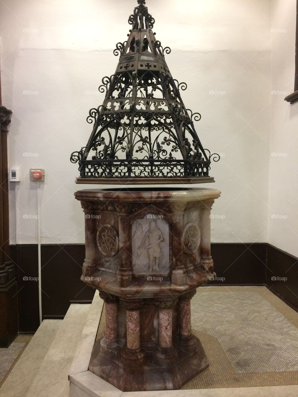 Baptismal in the library that is in an old church on Old Town Quebec 