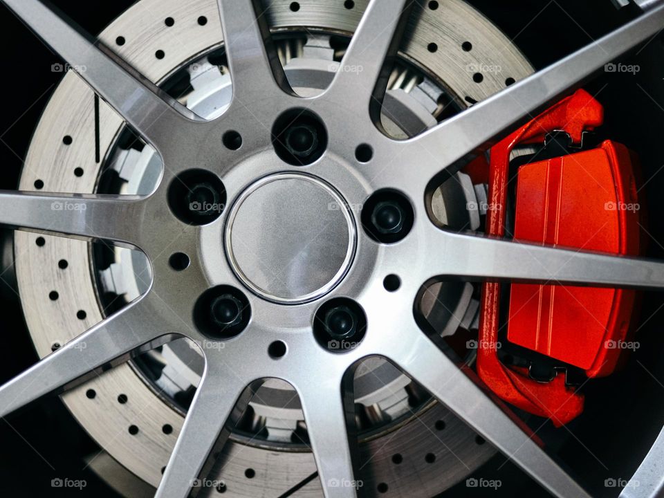 Close-up of a sports car brake disc and pad