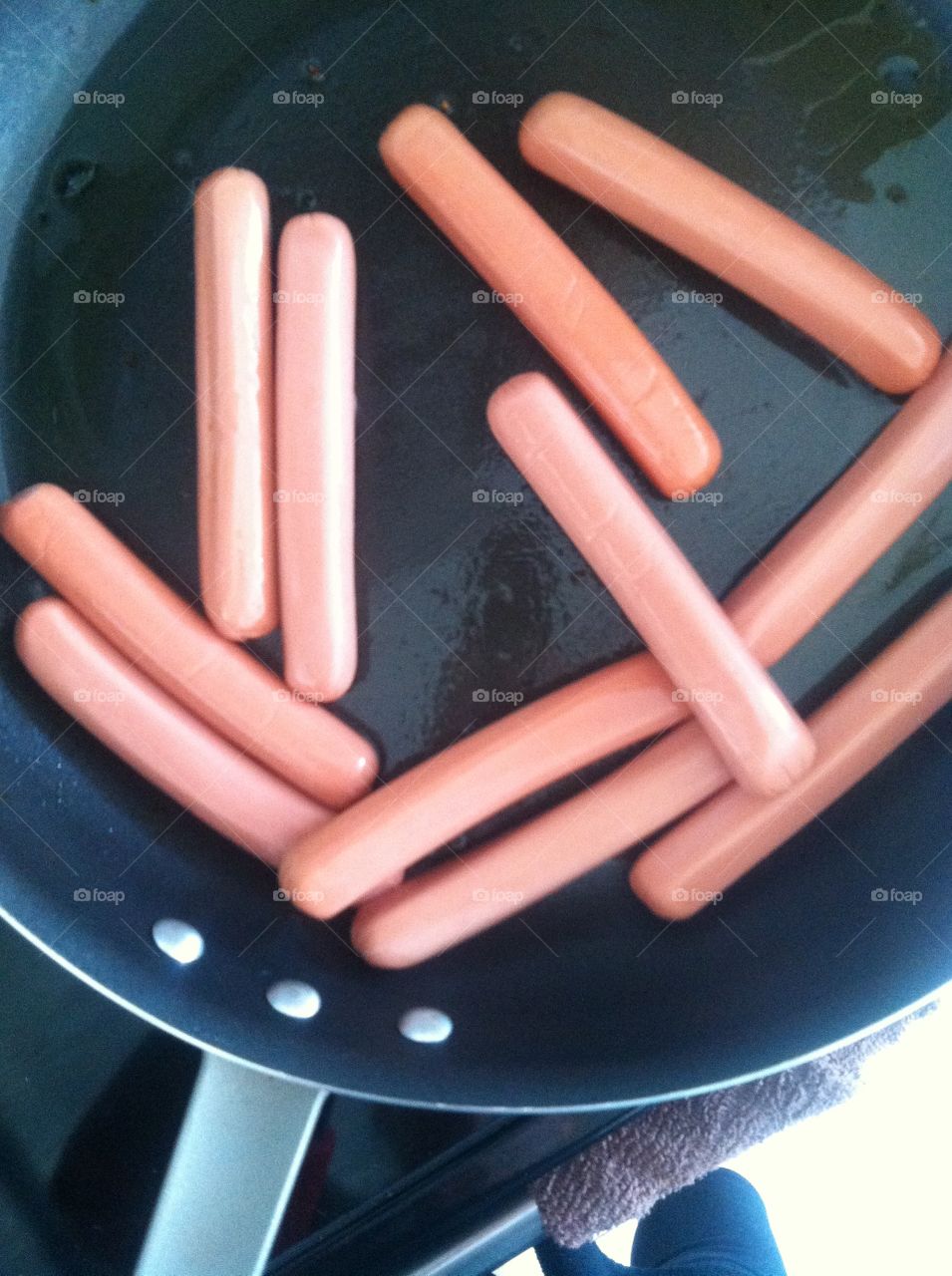 Hotdogs in frying pan 
