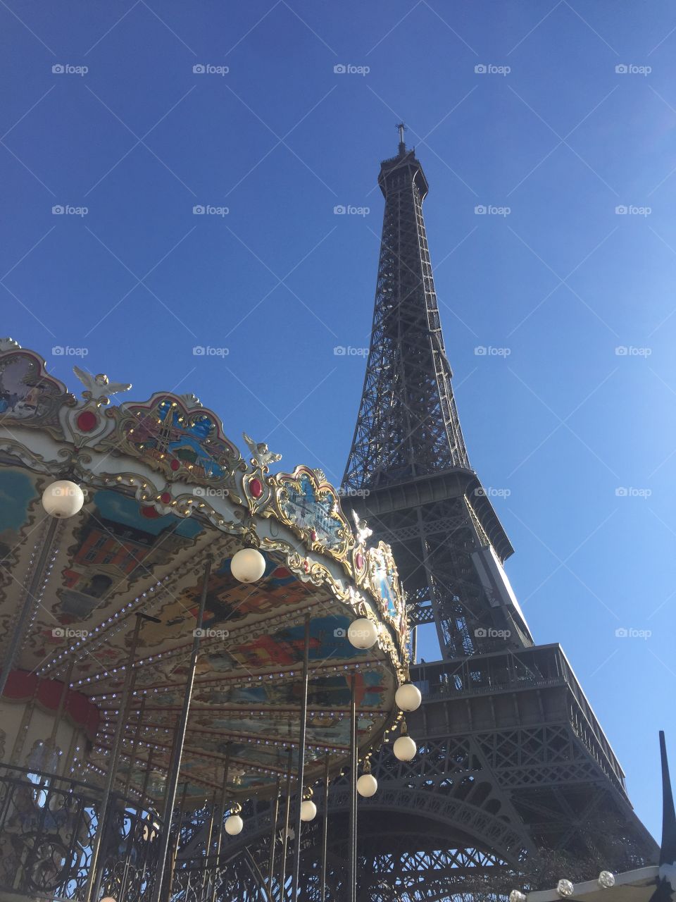 Eiffel Tower and colorful merry go round 