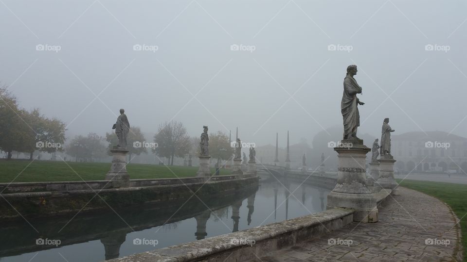 Ghostly and misty landscape. Prato della Valle. Padova, Veneto.