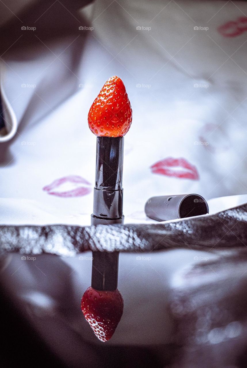 “Strawberry lipstick “ a different perspective of our daily lipsticks . The reflection on a water “paddle “ created for an add . 