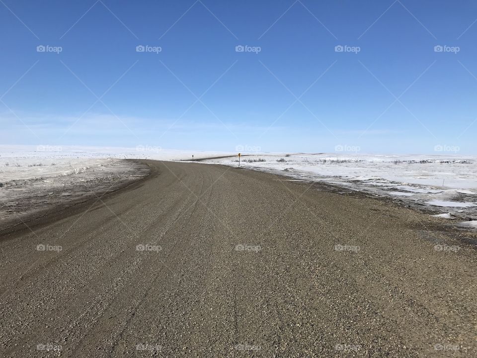 Inuvik-Tuktoyaktuk Highway in the Northwest Territories of Arctic Canada.  This desolate road connects the town of Inuvik to the hamlet of Tuktoyaktuk, which is on the Arctic Ocean.  It is the furthest north you can drive in Canada.