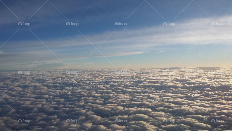 Aerial view of clouds. Flying into Chicago, I took this shot above the clouds. Very majestic!