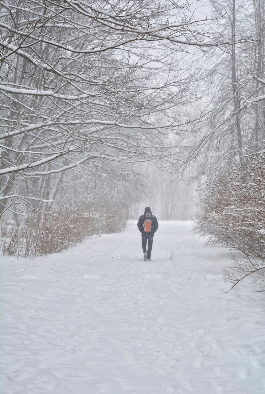 person walking in winter park lifestyle