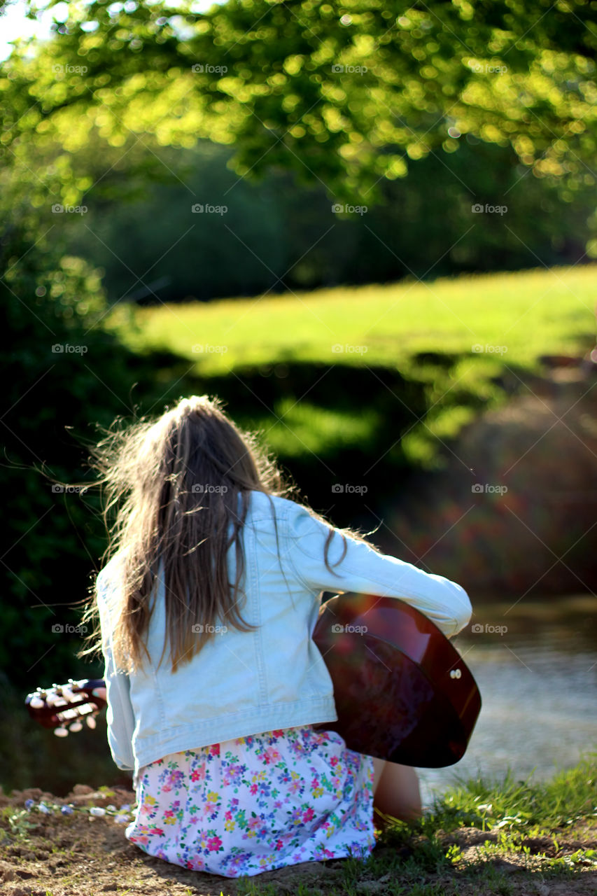 Girl playing the guitar 