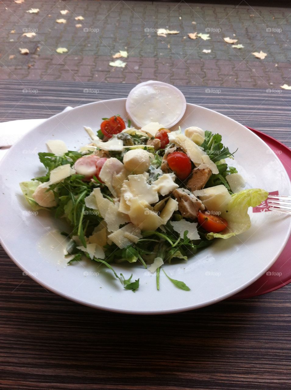 Delicious cheese salat in a white plate