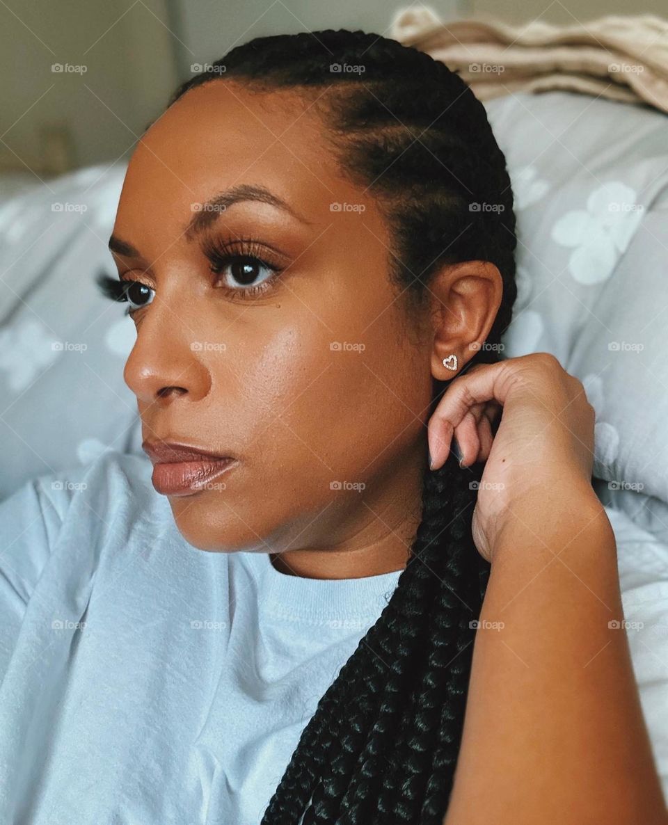 African American woman with makeup on. A moody picture.