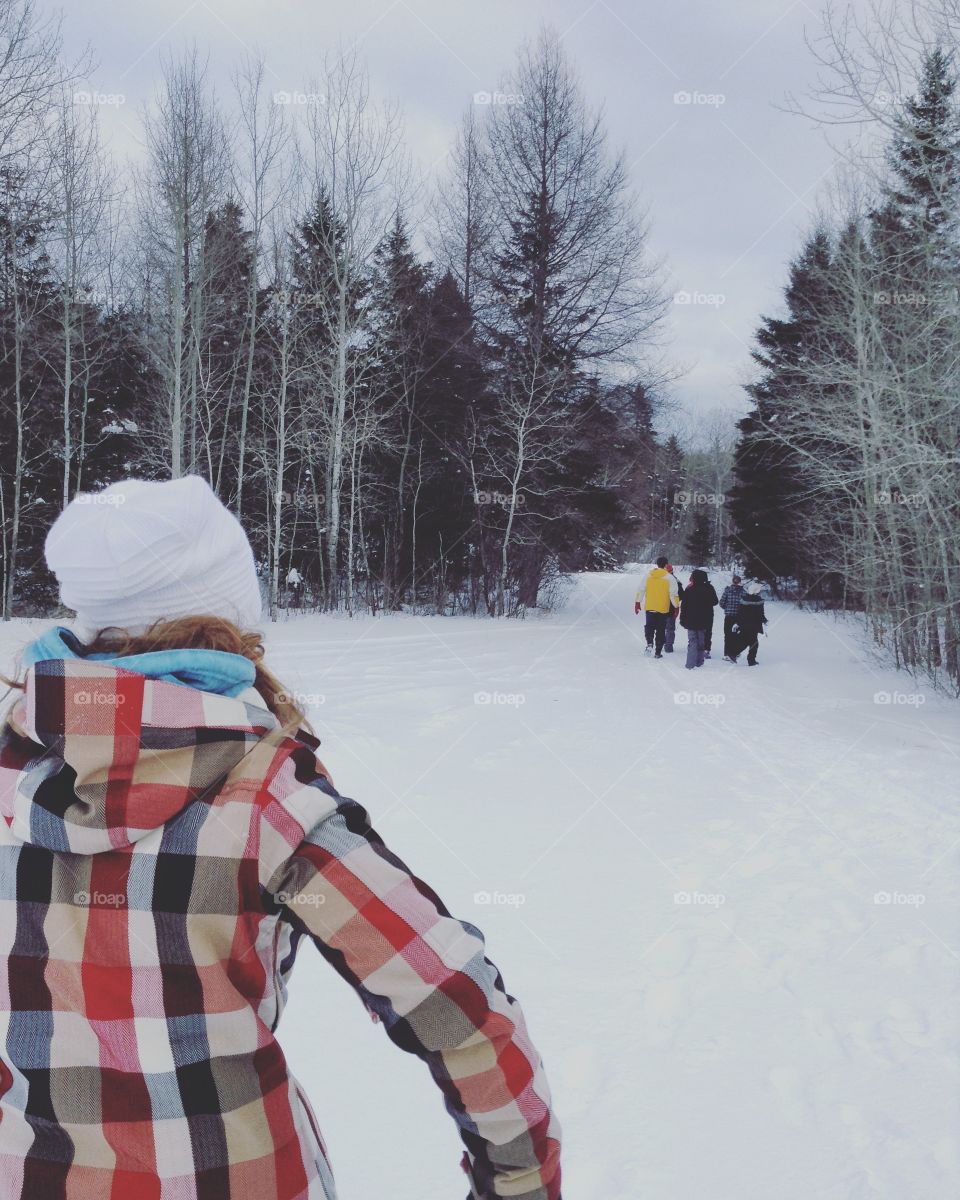 A group of friends walking winter hiking trails